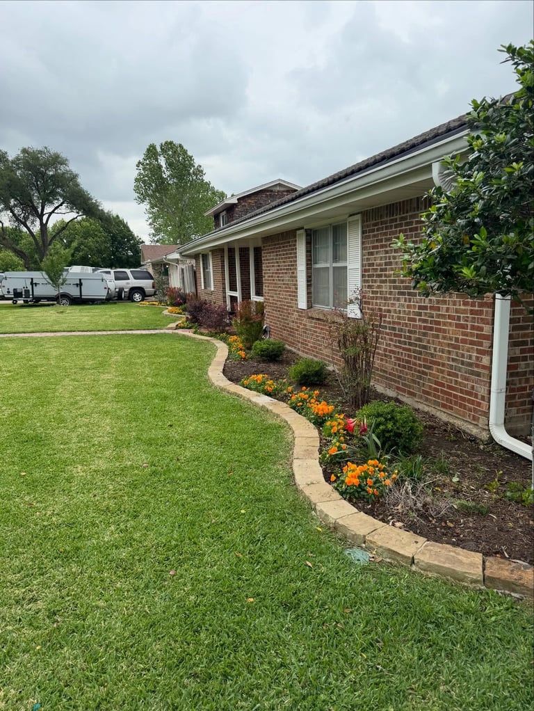 Interlocking paver walkway and retaining wall installed as a front-yard hardscape
