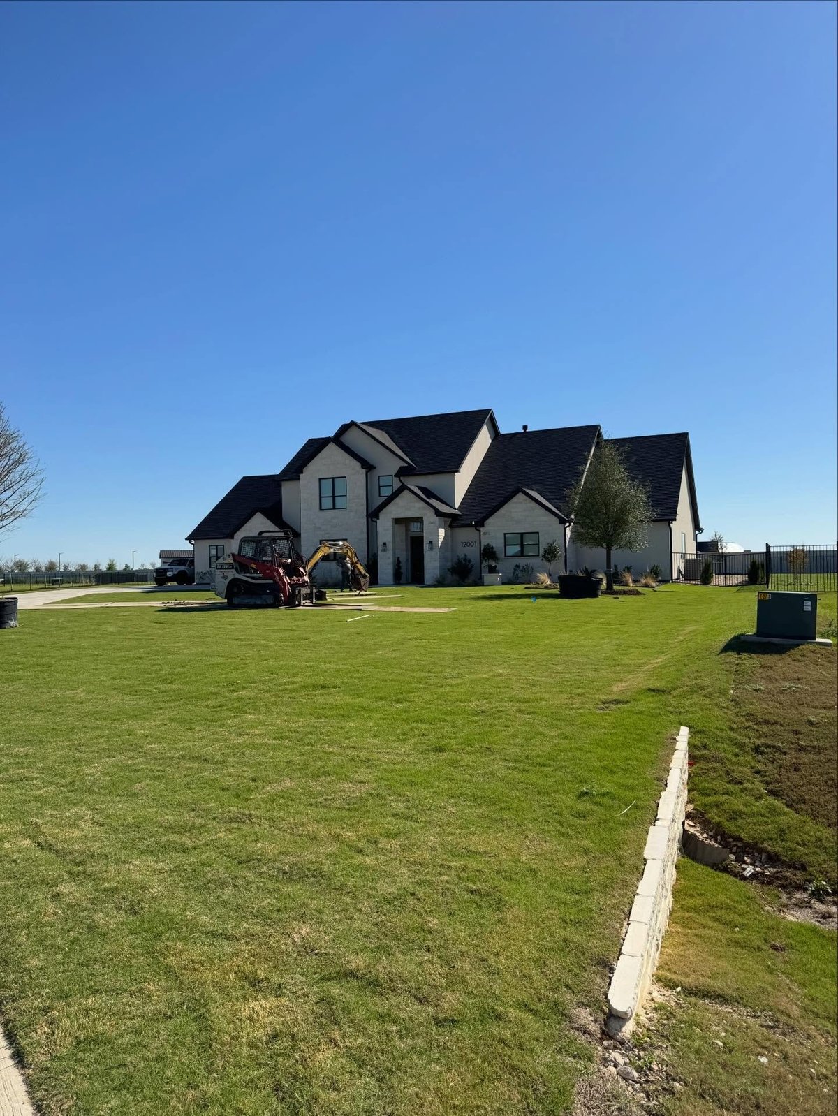 A modern home with a finished lawn, a real J&S project